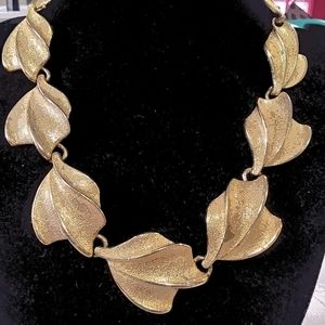 Gold tone fashion necklace.